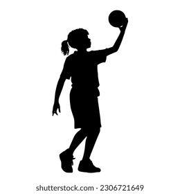 Silhouette of girl playing basketball. kid holding the basketball in hand silhouette.

