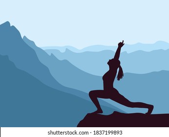 Silhouette of girl practicing yoga. Blue mountains in background. Healthy lifestyle.
