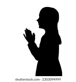 Silhouette of a girl praying