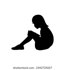 Silhouette of a girl reading a book