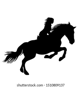A silhouette of a girl rider on a horse jumping