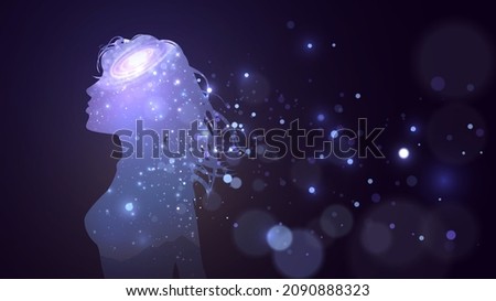 Silhouette of a girl with a space pattern and a galaxy on a dark background and blue dismembered sparks