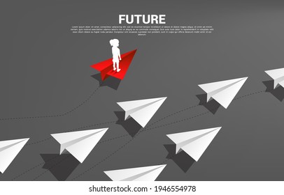 Silhouette of girl standing on red origami paper airplane go different way from group of white. Concept of future and children disruption.