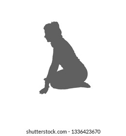 Silhouette of a girl with two tails on her head. The woman sits on her knees and leans on her hands. Side view.
