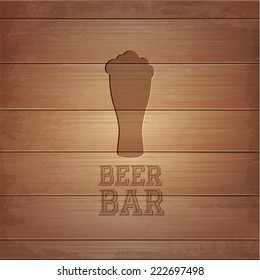 silhouette of glass of Beer on wood background