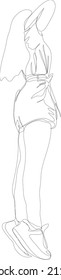 Silhouette of a graceful young girl in shorts and a T-shirt, who stands on her toes and stretches up