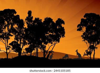 silhouette of gum trees and kangaroos feeding in the sunset