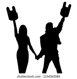 silhouette of a guy and a girl with raised hands with horns