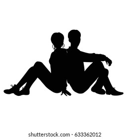 Silhouette of a guy and a girl sitting back to back