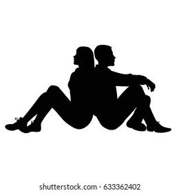 Silhouette of a guy and a girl sitting back to back