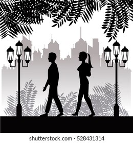 silhouette guy and girl walk park twon background