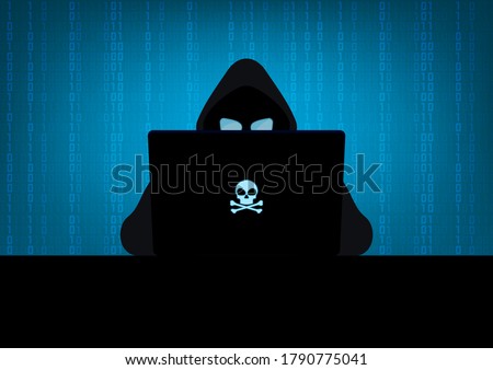 Silhouette of hacker wearing hood using laptop computer with glow in the dark blue skull and crossbones logo in dark room on blue binary code number background