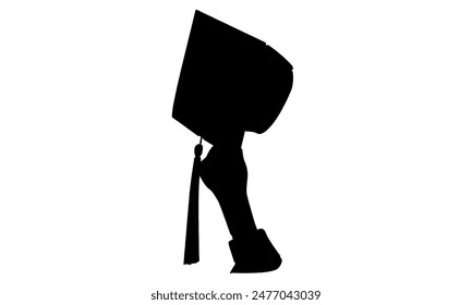 silhouette of hand holding graduation hat