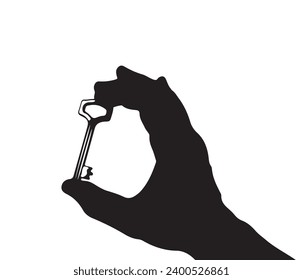silhouette of a hand holding a key