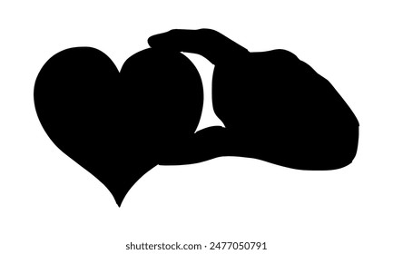 silhouette of hand holding a piece of heart