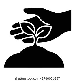 Silhouette of hand nurturing a seedling