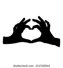 silhouette of hands folded in the heart