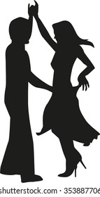 Silhouette of happy couple dancing