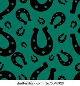 Silhouette of a happy horseshoe. Seamless vector pattern. Endless ornament. Isolated emerald background. Horse shoes. Imitation of ink drawing. Flat style. Idea for web design, covers, textiles.