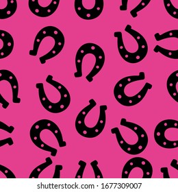 Silhouette of a happy horseshoe. Seamless vector pattern. Endless ornament. Isolated pink background. Horse shoes. Imitation of ink drawing. Flat style. Idea for web design, covers, textiles. 