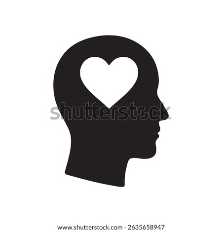 Silhouette of a head with a heart shape inside representing love and emotions in the mind concept