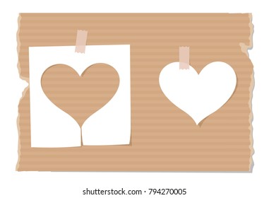 Silhouette of heart cut out from paper on cardboard