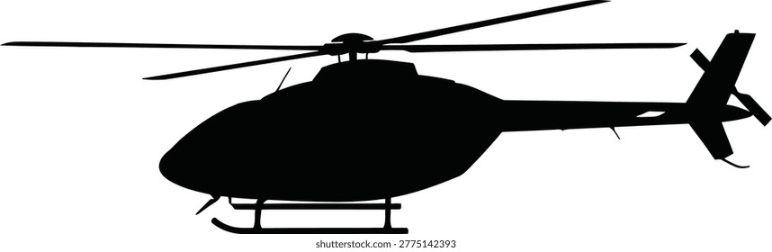Silhouette of a helicopter flying