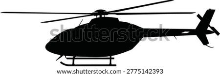 Silhouette of a helicopter flying