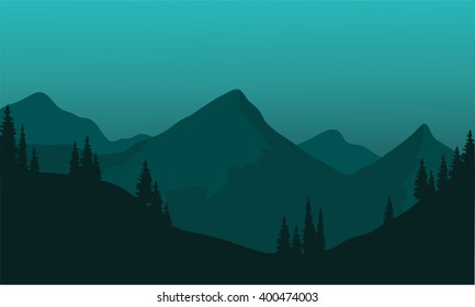 Silhouette of hils with green background at night