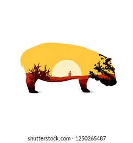 Silhouette of hippo with african landscape. Sunset.