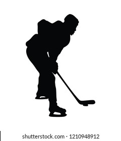 Silhouette of hockey player  with stick and a washer isolated on white. Vector