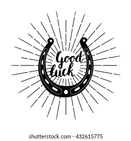 Silhouette of a horseshoe with inscription "Good luck".Hand drawn lettering poster. Inspirational vector typography.