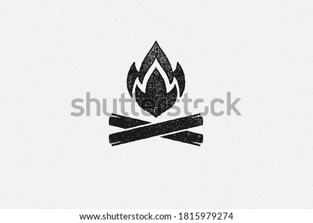 Silhouette of hot campfire burning on logs on campsite hand drawn stamp effect vector illustration. Vintage grunge texture on old paper for poster or label decoration.