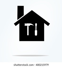 Silhouette of a house with a Screwdriver and a hammer. Vector image.