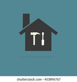 Silhouette of a house with a Screwdriver and a hammer. Vector image.