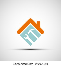 Silhouette of a house with a wrench and a hammer. Vector image.