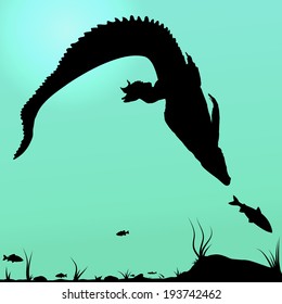 Silhouette of Hunting young Crocodile and underwater landscape