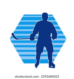 Silhouette of an ice hockey player wearing helmet and uniform carrying hockey stick in action pose