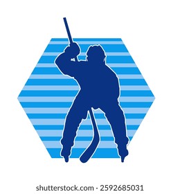 Silhouette of an ice hockey player wearing helmet and uniform carrying hockey stick in action pose