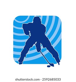 Silhouette of an ice hockey player wearing helmet and uniform carrying hockey stick in action pose