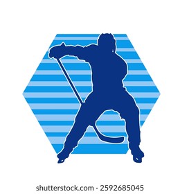 Silhouette of an ice hockey player wearing helmet and uniform carrying hockey stick in action pose