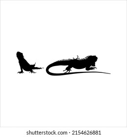 Silhouette of Iguana Reptiles (a genus of herbivorous lizards that are native to tropical areas of Mexico, Central America, South America, and the Caribbean). Vector Illustration 