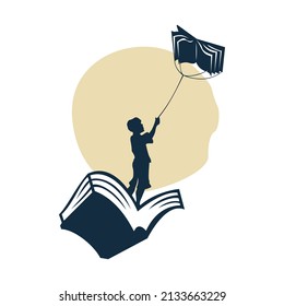 Silhouette illustration of a boy playing a kite on a book