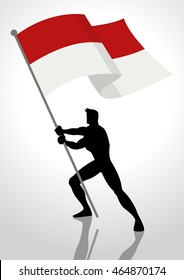 Silhouette illustration of a man holding the flag of Indonesia or Monaco, flag bearer, patriotism concept