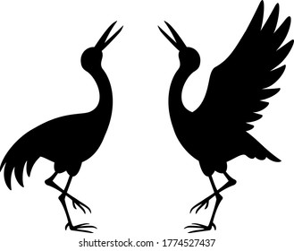 Silhouette illustration of a pair of cranes standing and facing each other