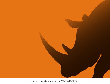 Silhouette illustration of a rhinoceros against bright orange background