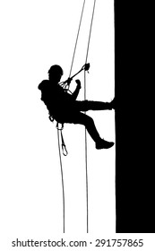 silhouette image of wall climbing