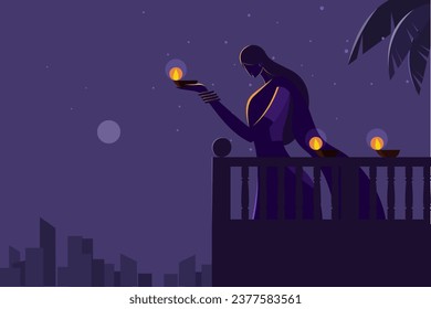 Silhouette of an Indian woman holding Diwali festival lamps in the night 