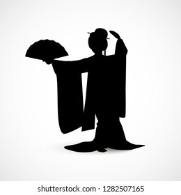 Silhouette of Japanese woman dressed in traditional kimono costume dancing with a fan isolated on white background