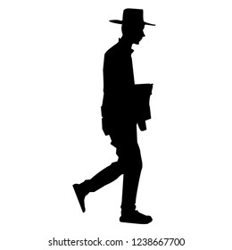 Silhouette of a Jew in a hat. Hasid carries the book of the Torah. Orthodoxy is a Jew. Isolated vector illustration. Isolated background. Black on white.